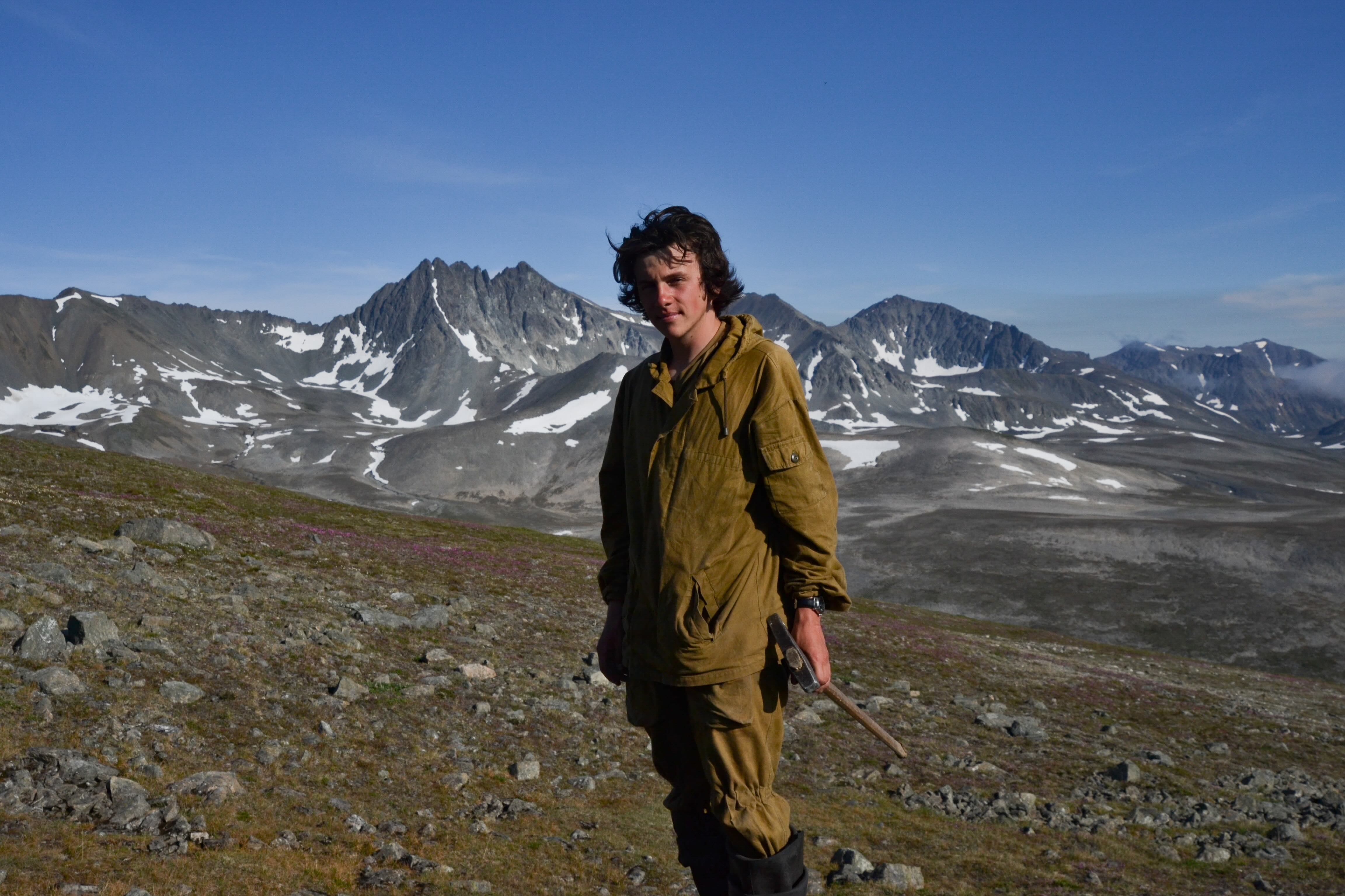 A young man in the mountains.