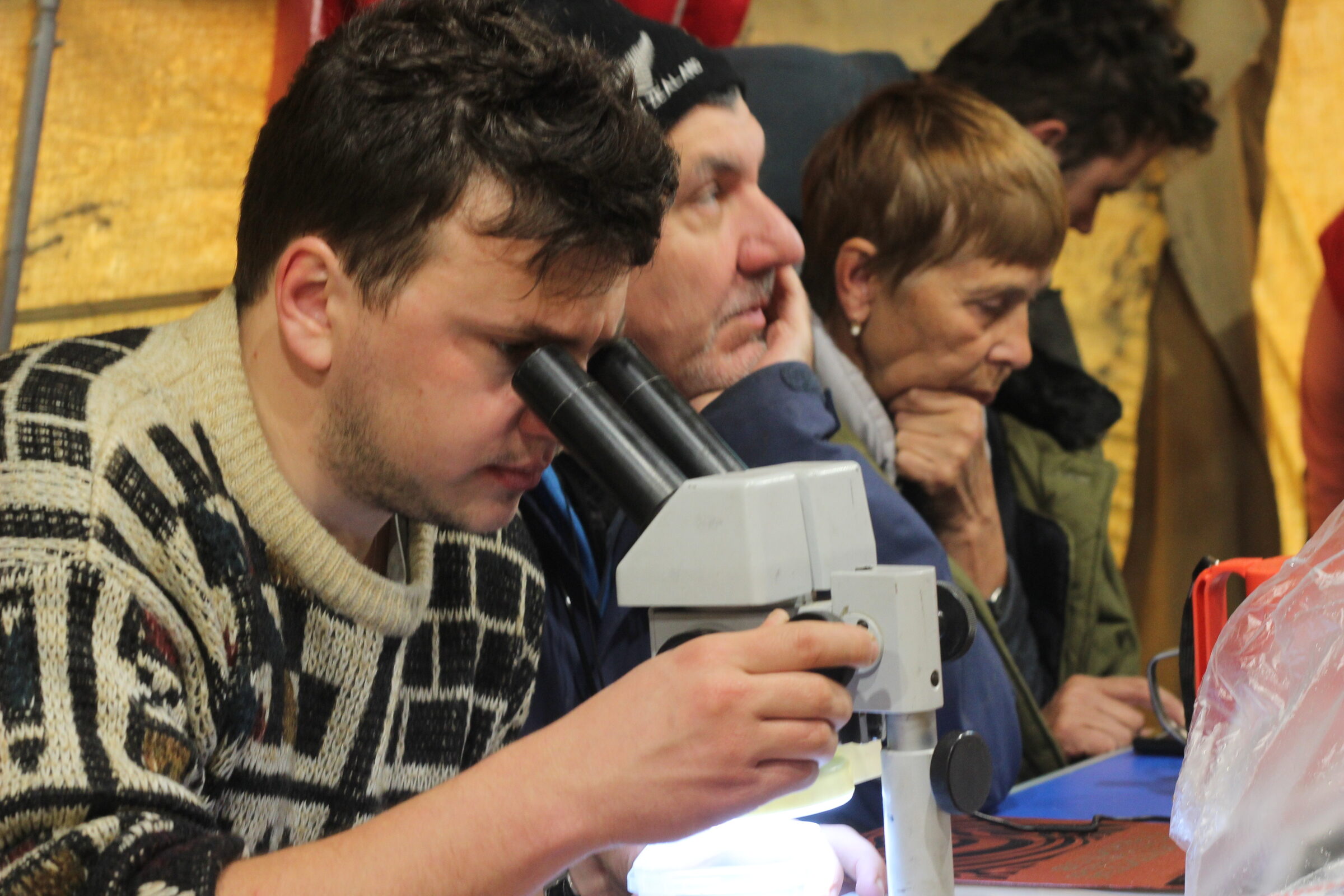 Anton Kutyrev working at a microscope.
